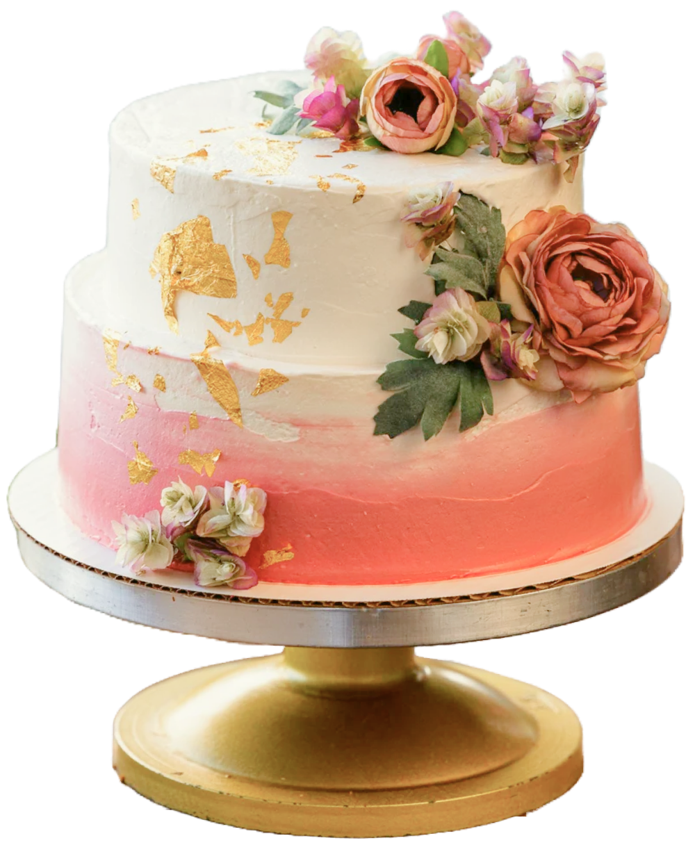 two-tiered pink ombre wedding cake with gold flakes and fake flowers